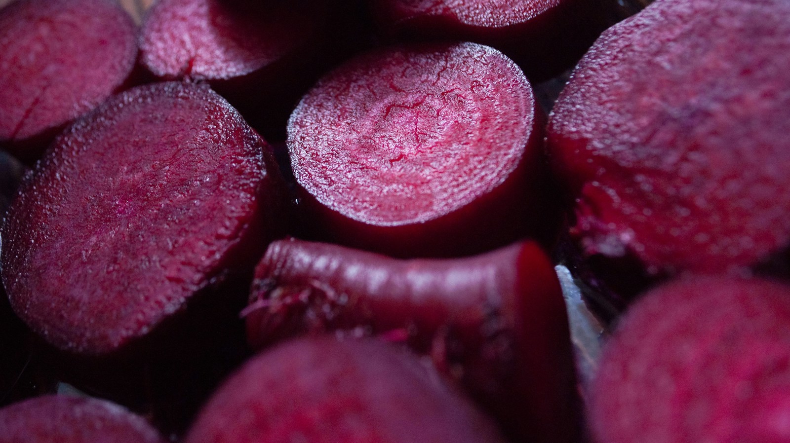 Close-up of sliced deep red beet roots showing their fine rings